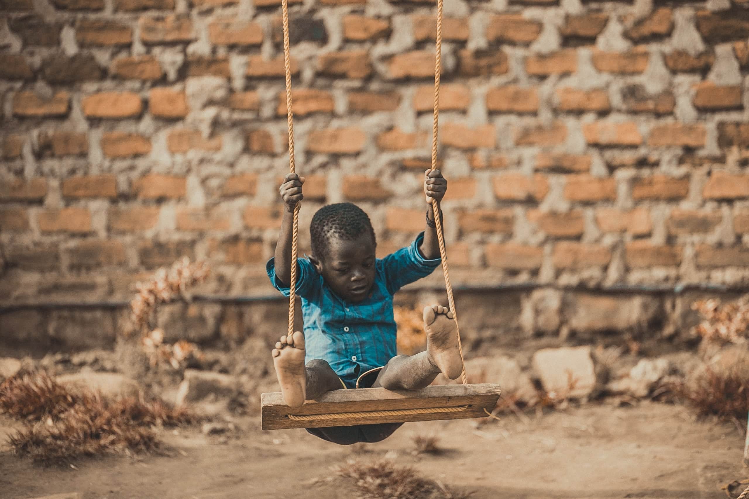 africa-boy-brick-wall-1686467-1